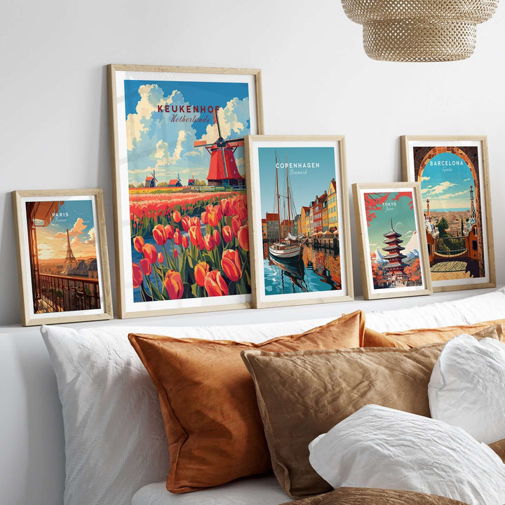 Framed Keukenhof print featuring tulips and windmill alongside other city prints on a cozy sofa decor.