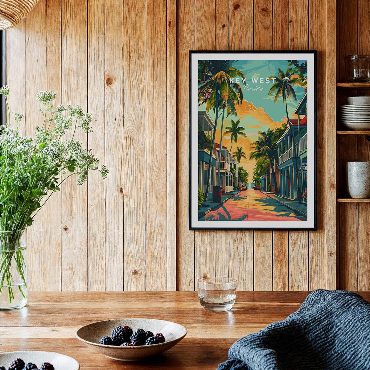 Key West Wall Art Print - Florida Travel Poster displayed in a cozy kitchen setting with wooden walls and tropical decor.