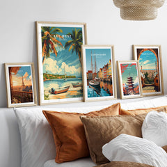Key West Poster featuring tropical scenery among other framed travel posters on a stylish couch.