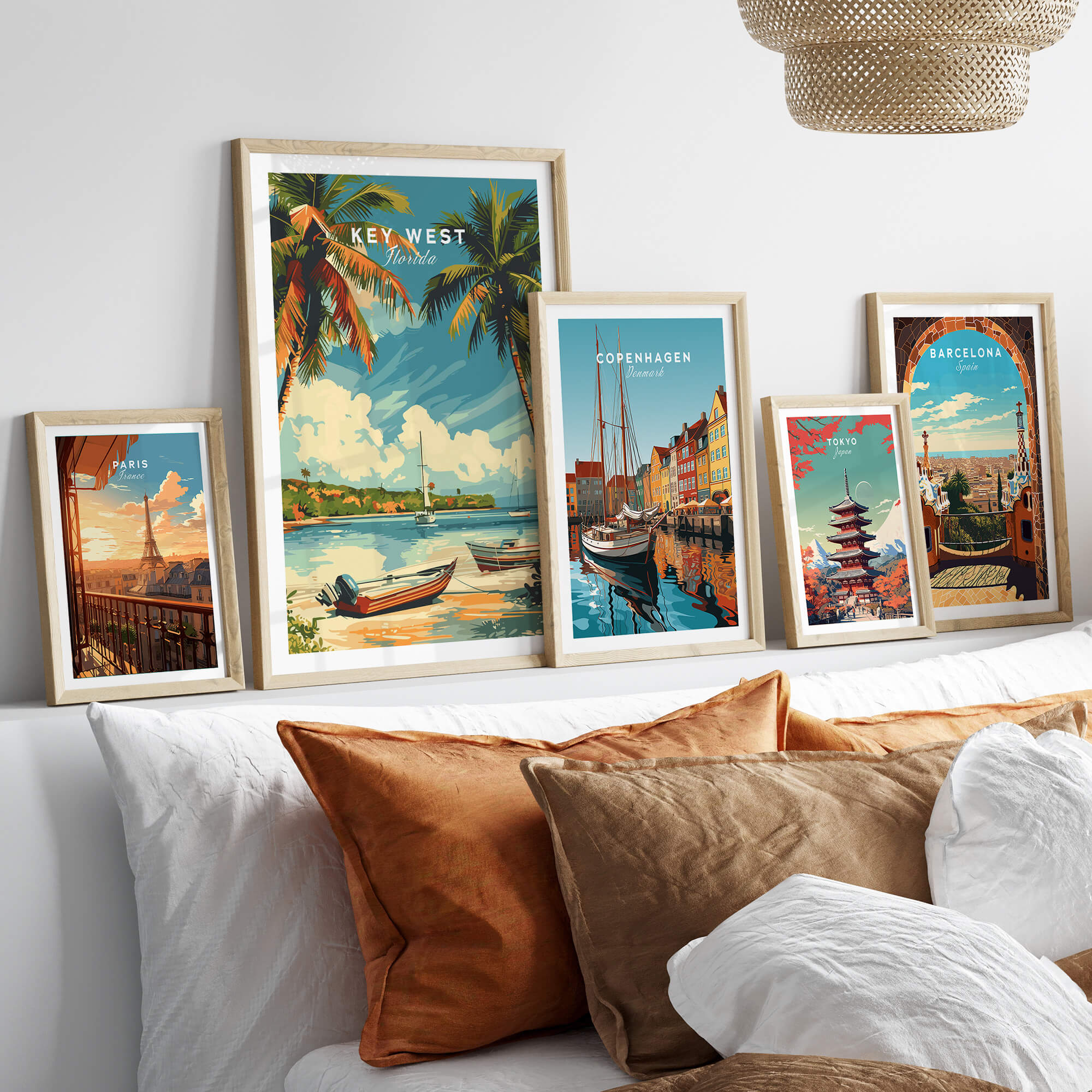 Key West Poster featuring tropical scenery among other framed travel posters on a stylish couch.