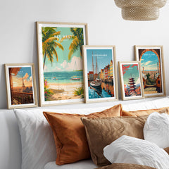 Key West Travel Poster displayed with other travel posters on a decorative shelf in a cozy living room setting.