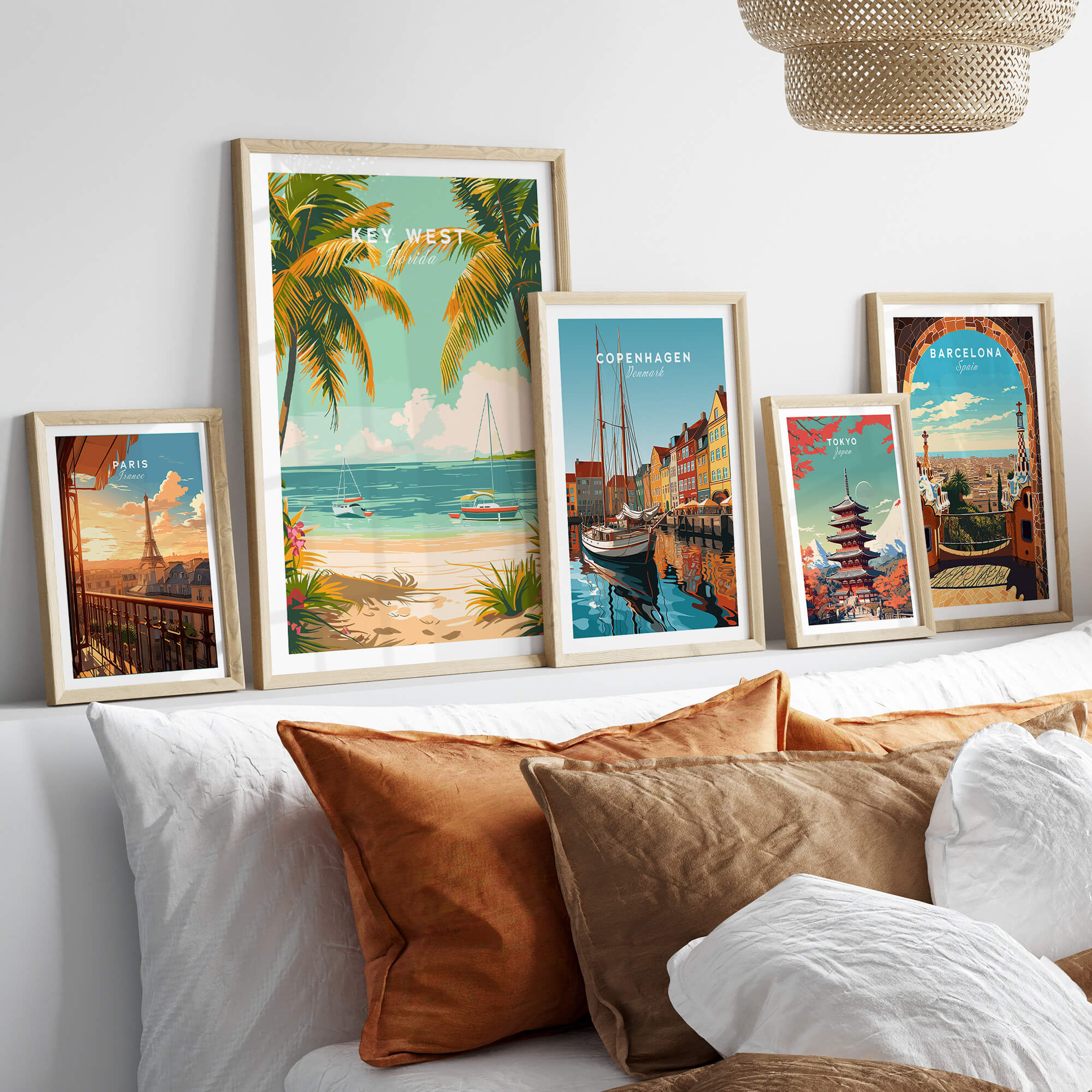 Key West Travel Poster displayed with other travel posters on a decorative shelf in a cozy living room setting.