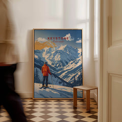 Keystone Travel Poster - Colorado showcasing a skier against majestic mountains in a stylish interior setting.