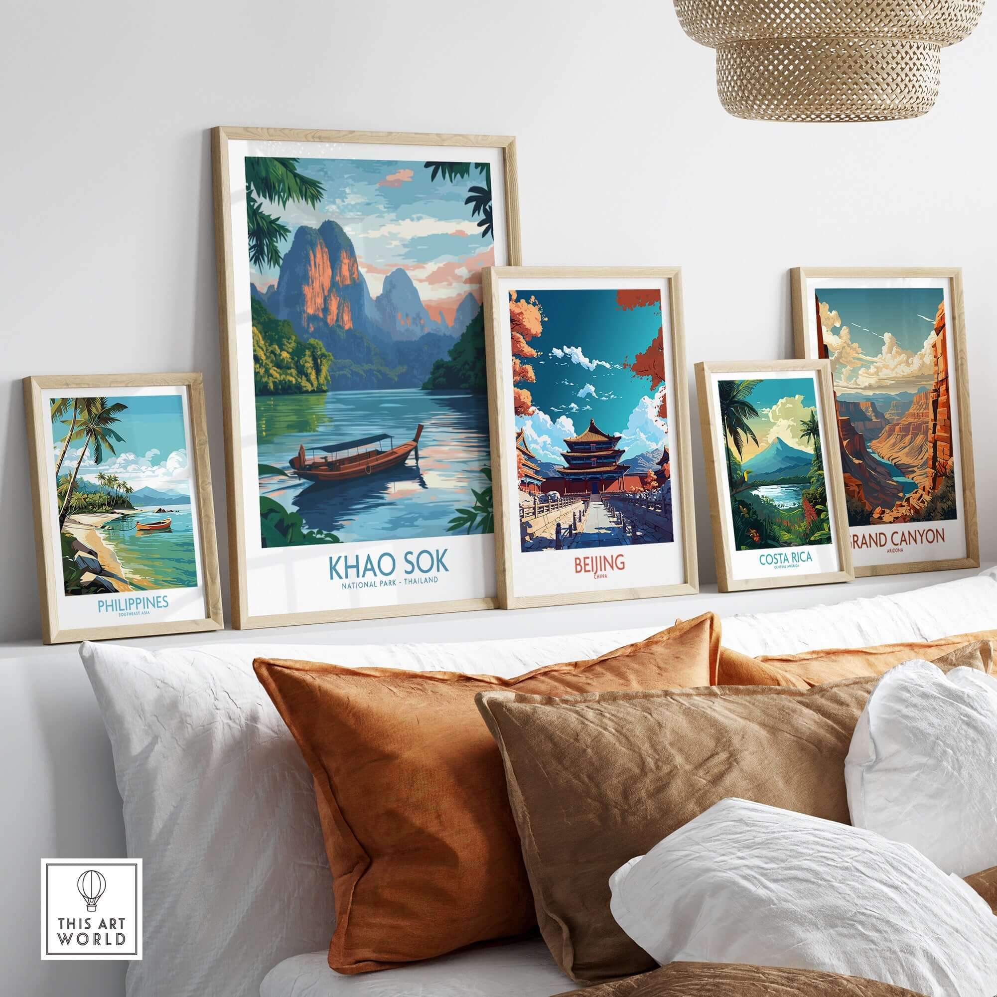 Decorative gallery wall featuring Khao Sok Poster and travel-themed prints in a cozy living room setting.