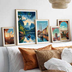 Khao Sok Travel Print displayed among other travel prints on a cozy shelf, highlighting vibrant landscapes and adventures.