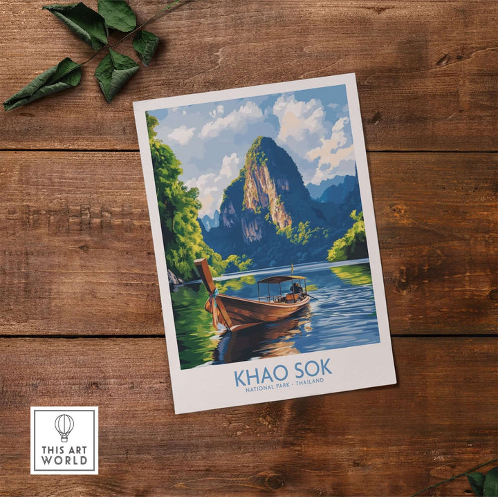 Khao Sok wall art print featuring a serene landscape with a boat in front of mountains, evoking Thailand's natural beauty.