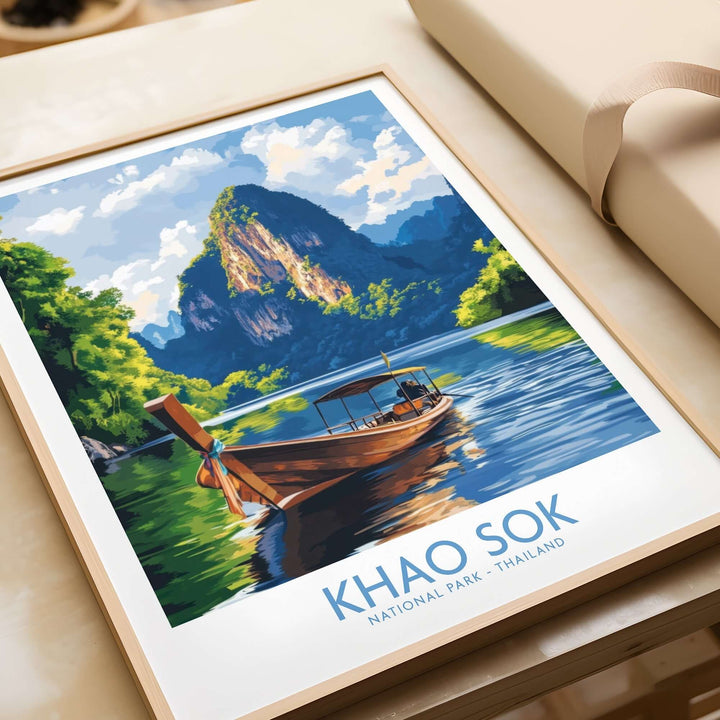 Khao Sok Wall Art Print depicting a serene boat scene in Khao Sok National Park, Thailand, featuring lush mountains and water.