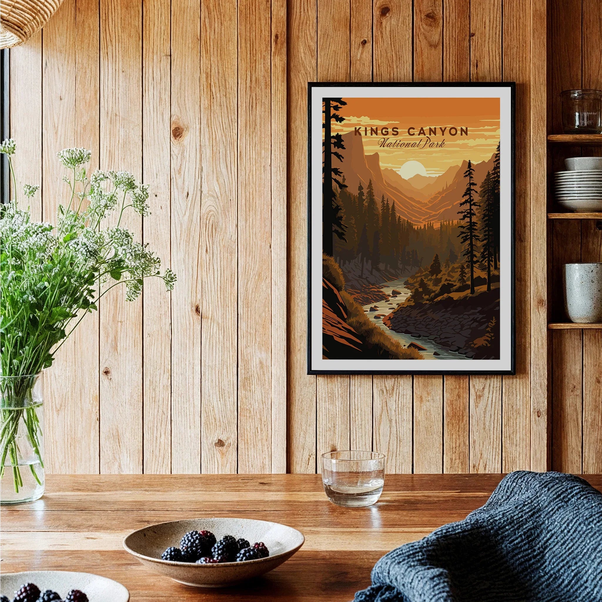 Framed Kings Canyon National Park art print on wood wall in cozy kitchen with rustic decor