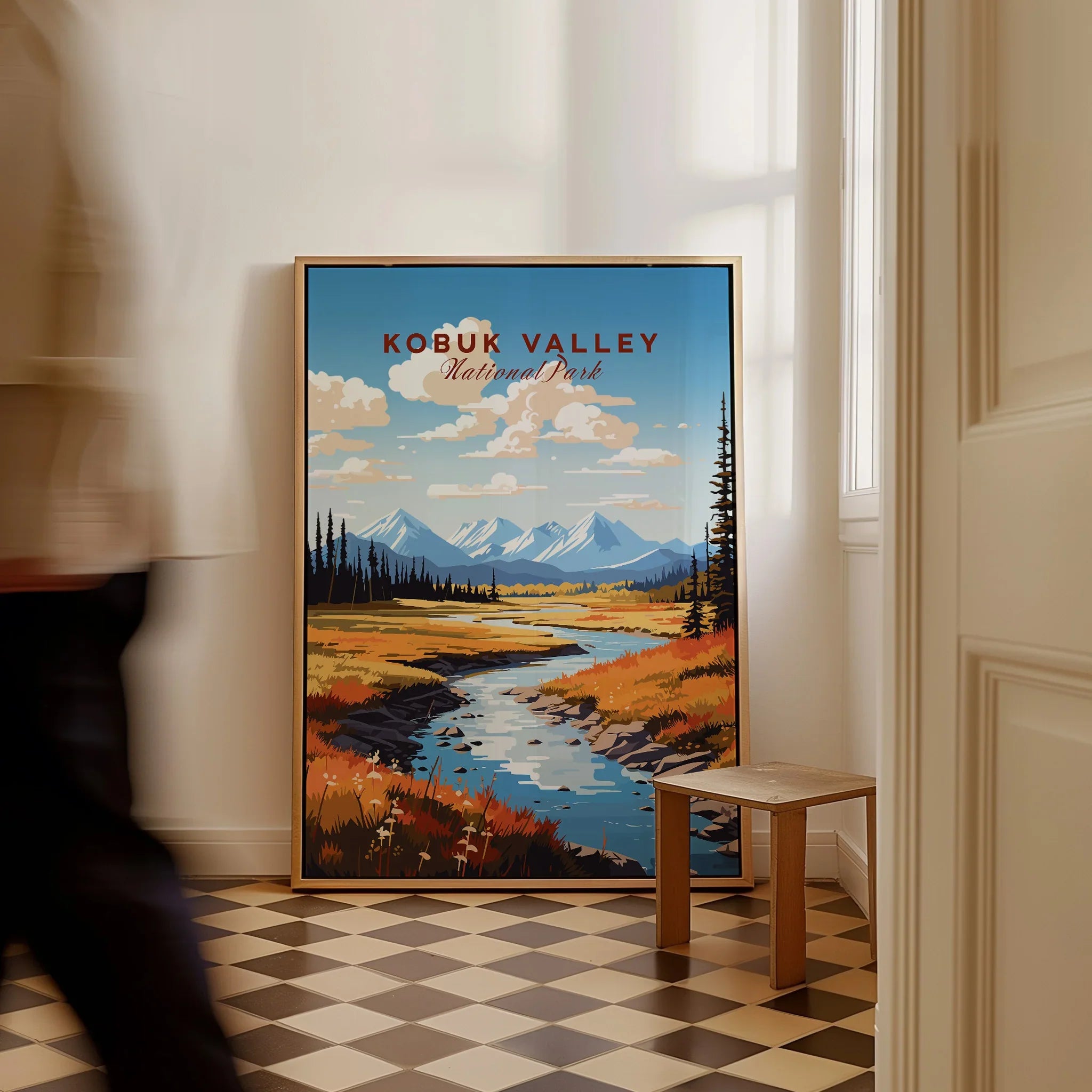 Framed Kobuk Valley National Park travel poster with mountains and river, leaning on wall