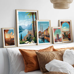 Gallery wall featuring Kotor Montenegro print and travel posters of Copenhagen and Barcelona in a cozy home setting.