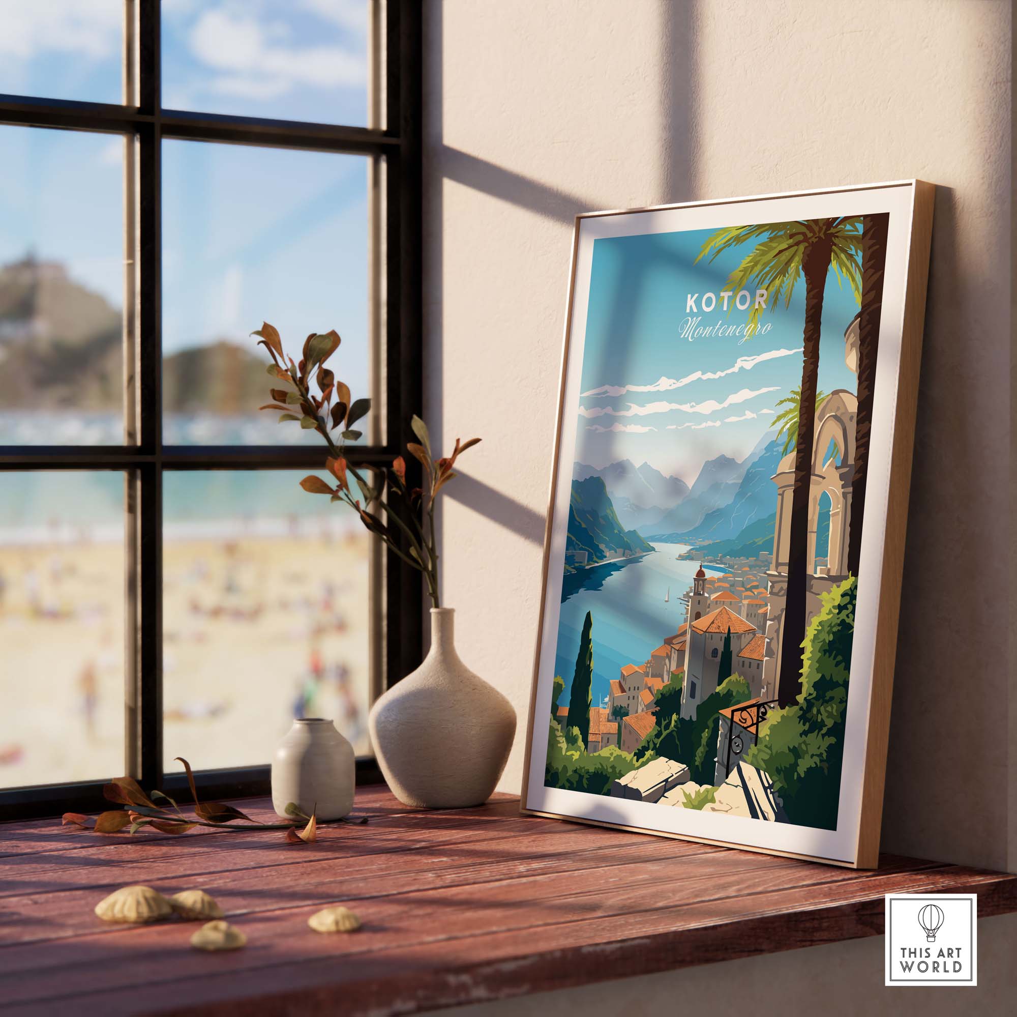 Kotor Montenegro travel poster print in a stylish room setting with a beach view through the window.