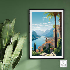 Kotor Montenegro travel poster print displayed on a green wall with a leafy plant, showcasing vibrant landscapes.