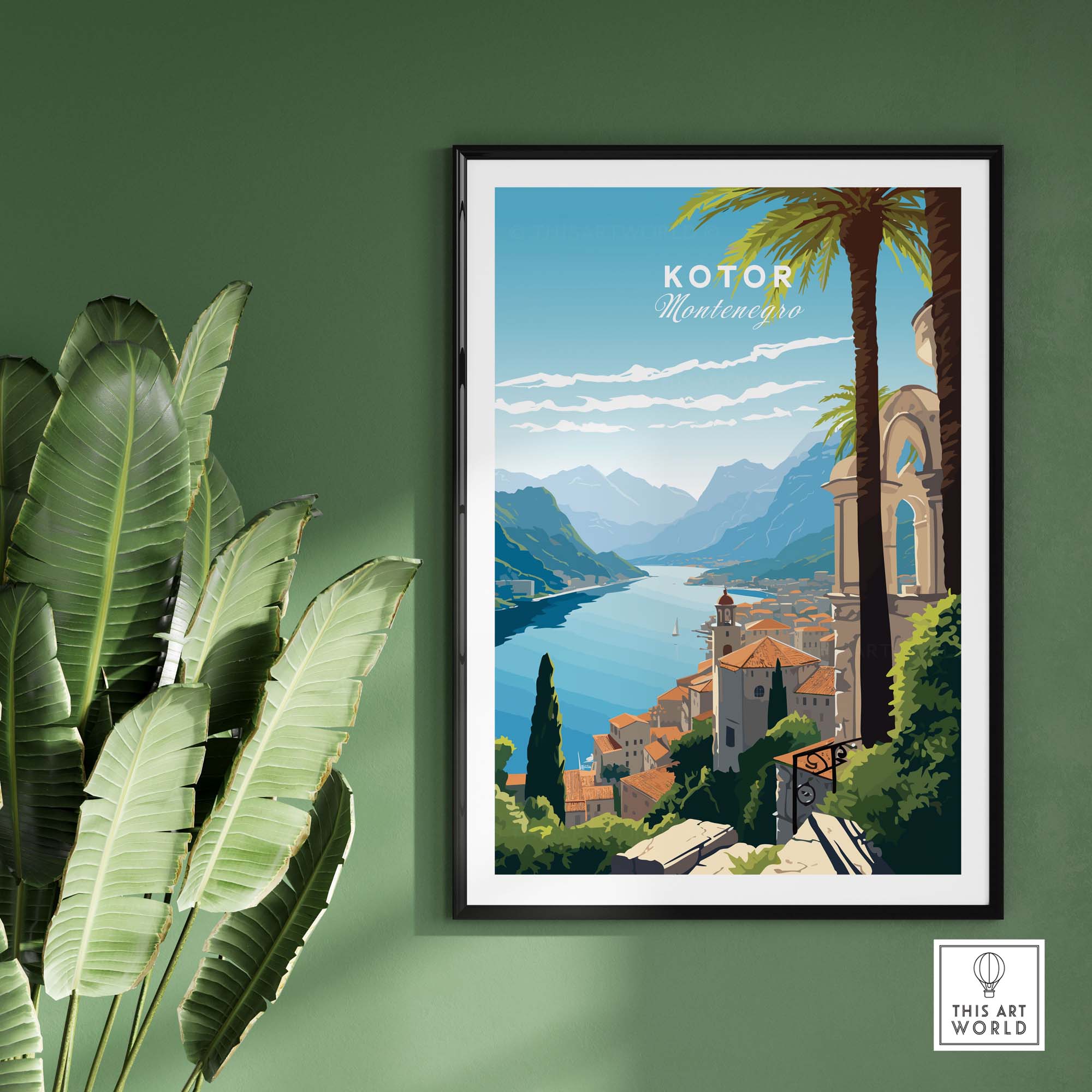 Kotor Montenegro travel poster print displayed on a green wall with a leafy plant, showcasing vibrant landscapes.