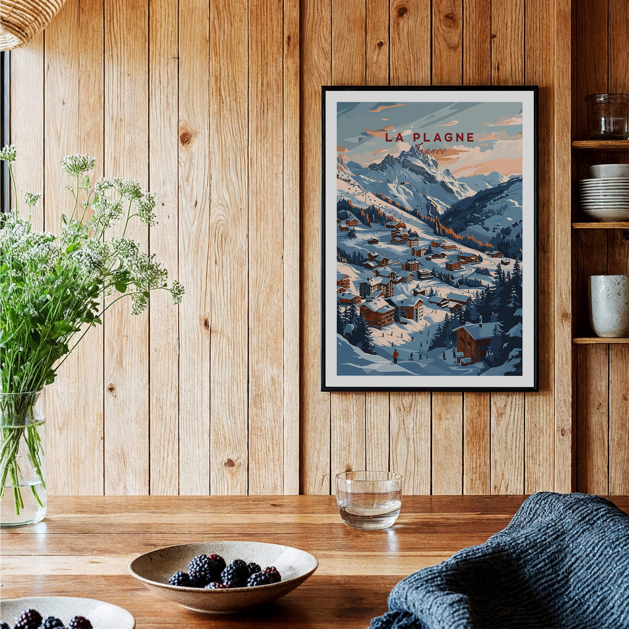 La Plagne Ski Poster displayed on a wooden wall, featuring snowy mountains and a picturesque village scene.