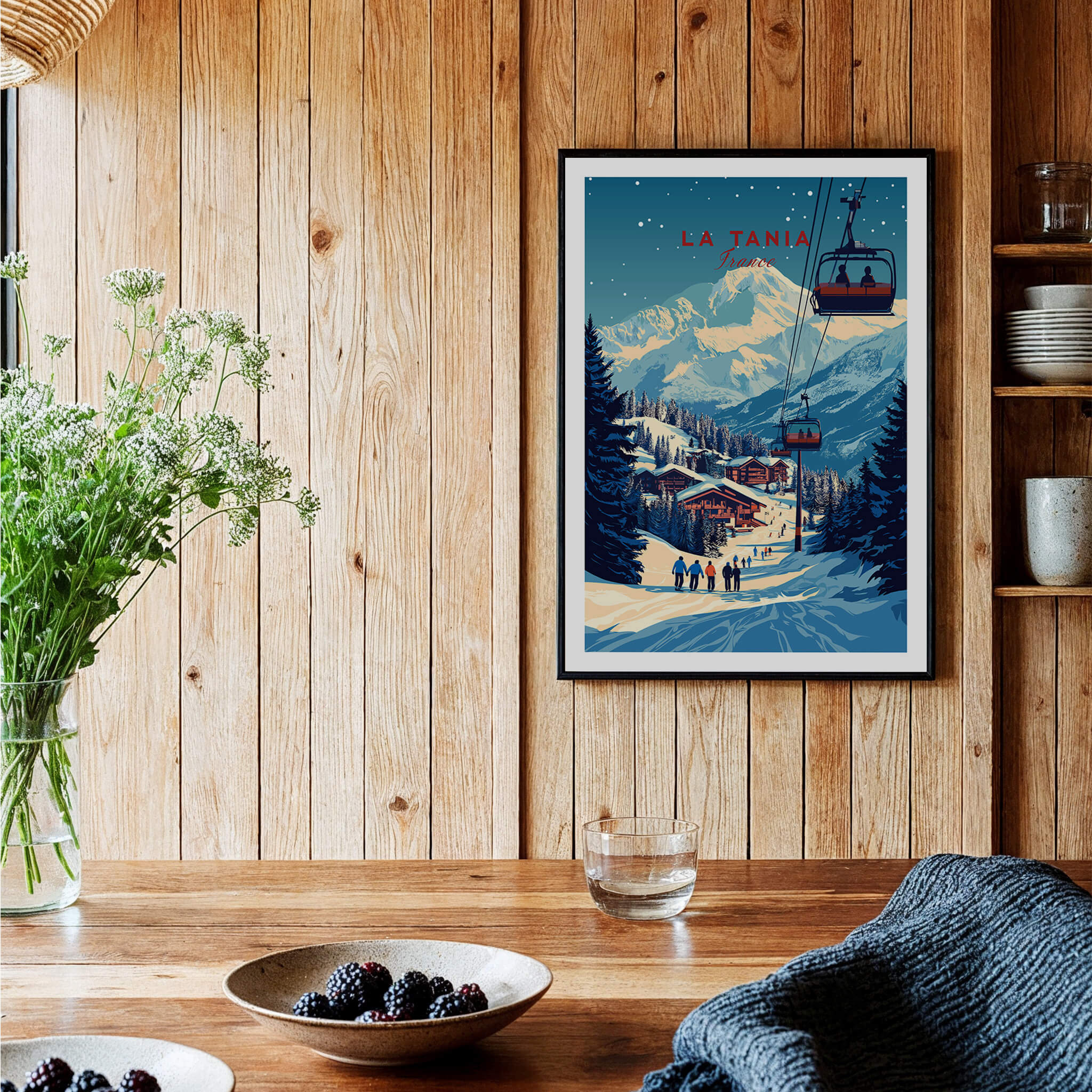 La Tania Wall Art Ski Print showcasing a picturesque alpine village and ski slopes in a cozy interior setting.