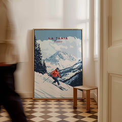 Ski Print La Tania France featuring a skier on snow-covered slopes framed on an indoor wall.