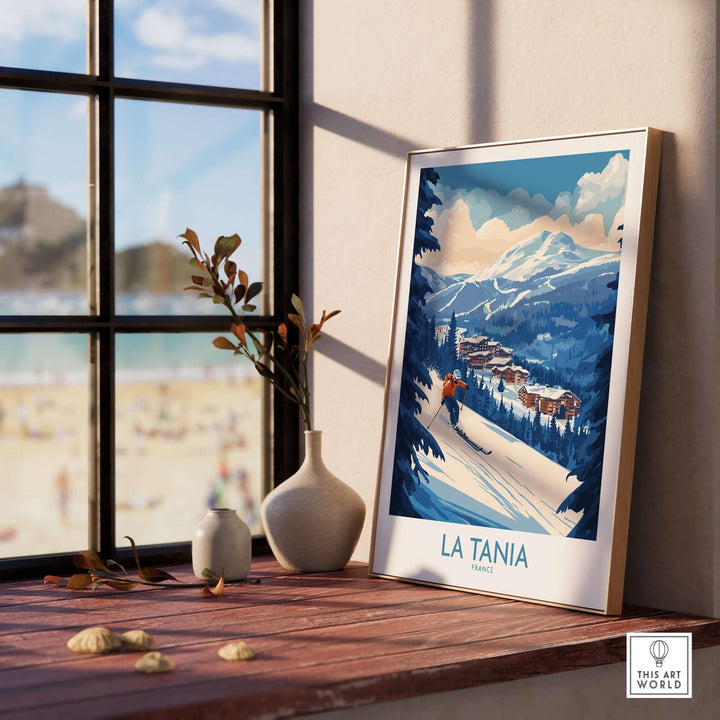 La Tania ski poster displayed in a sunny room, showcasing beautiful snowy mountains and a charming resort landscape.