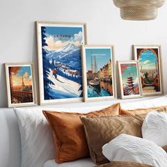 La Tania Ski Print alongside scenic travel prints in stylish frames on a wall above cozy pillows, perfect for home decor.