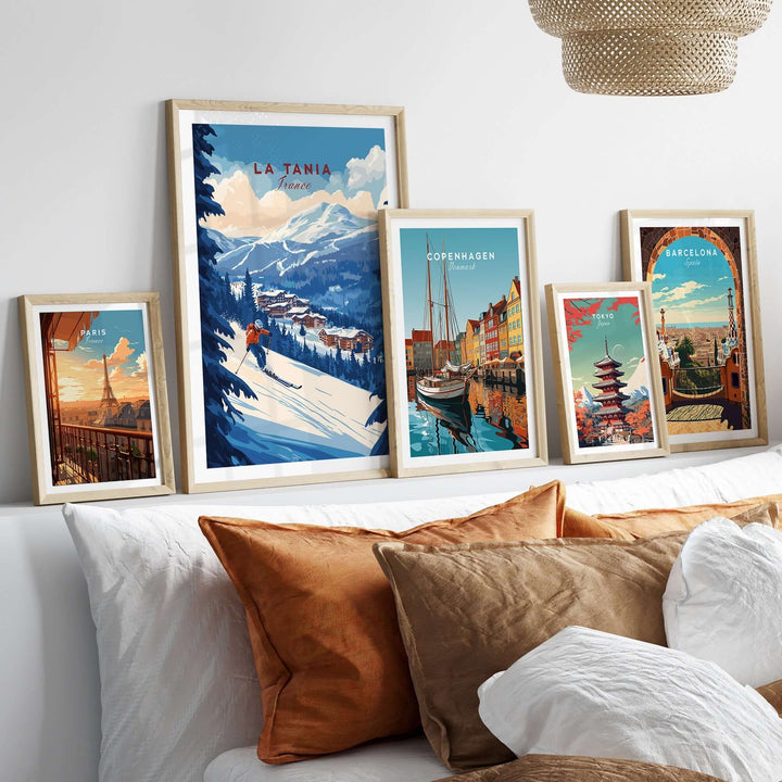 La Tania Ski Print alongside scenic travel prints in stylish frames on a wall above cozy pillows, perfect for home decor.