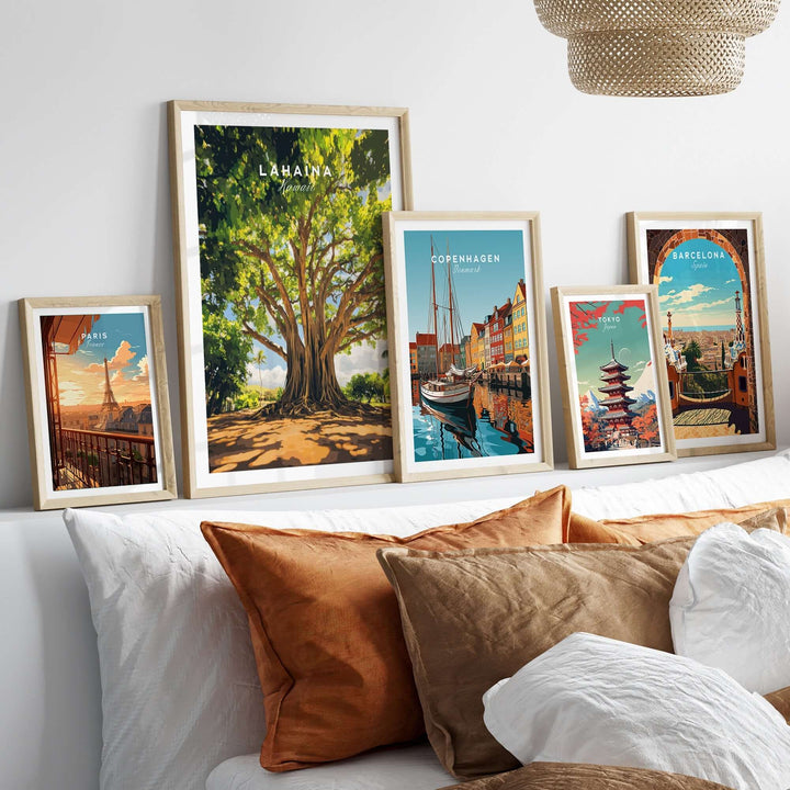 Lahaina Banyan Tree poster displayed among framed artwork on a stylish wall with decorative pillows.