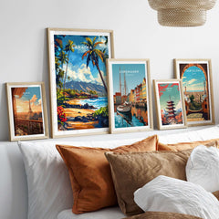 Lahaina Print Hawaii displayed among vibrant travel posters on a stylish sofa.