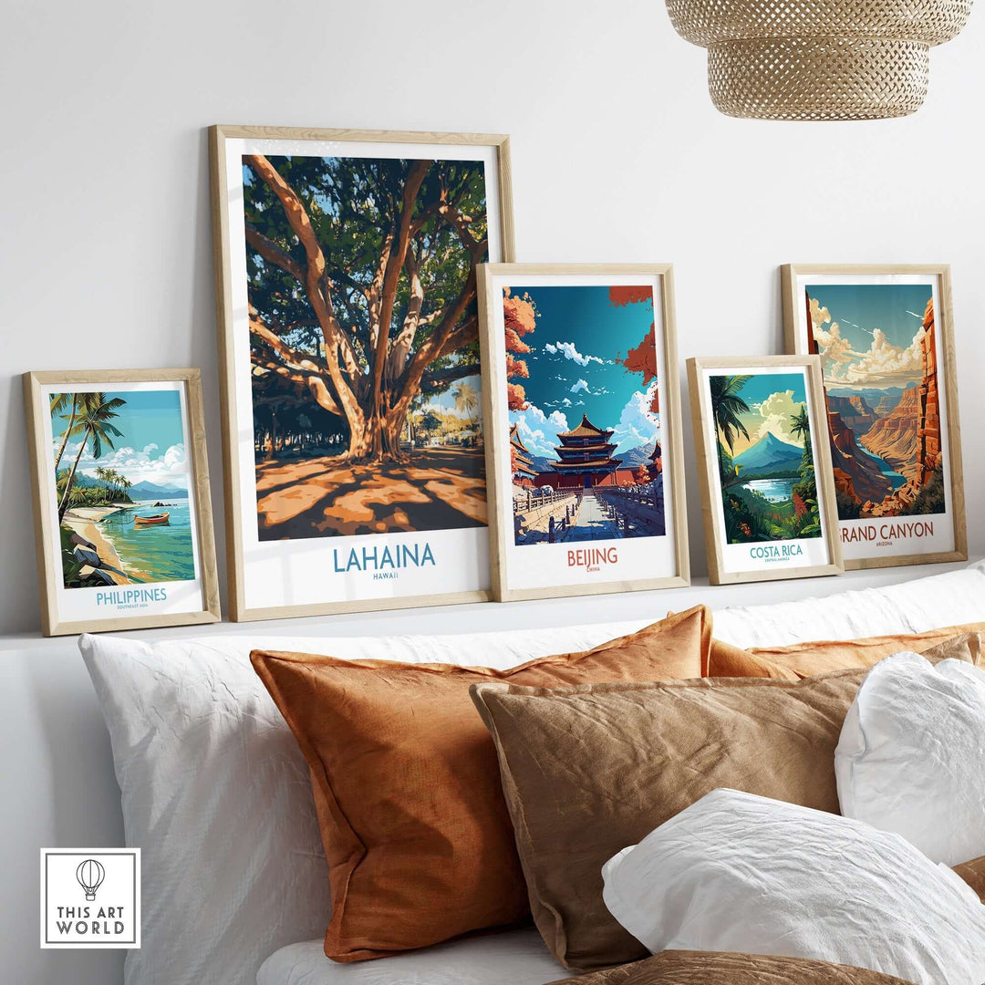 Lahaina travel poster displayed among framed art from various destinations, enhancing interior decor with a tropical vibe.