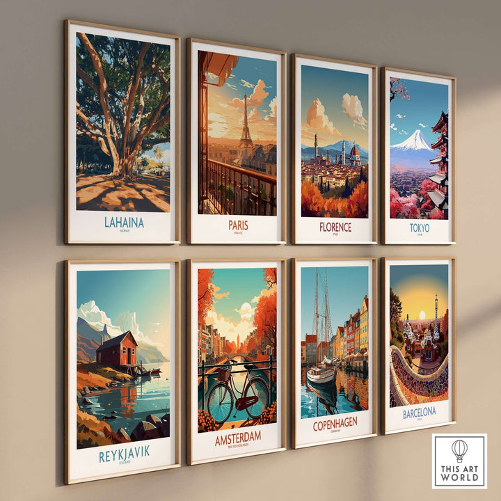 Vintage travel posters of Lahaina, Paris, Florence, Tokyo, Reykjavik, Amsterdam, Copenhagen, and Barcelona displayed on a wall.