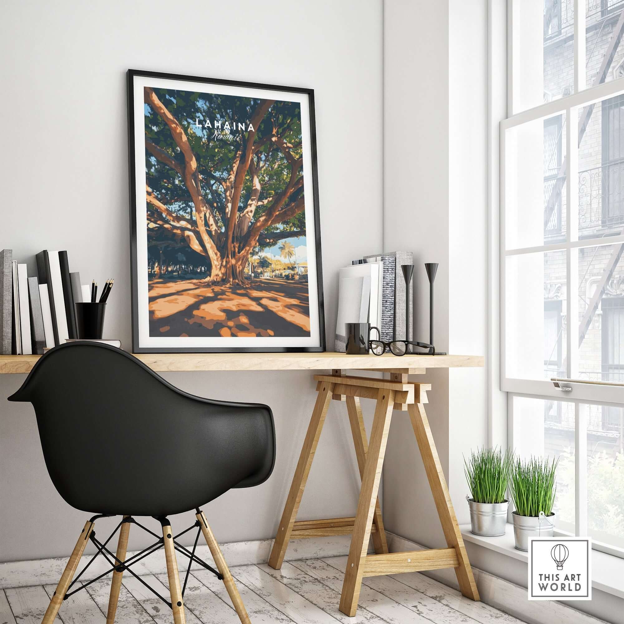 Lahaina Travel Print showcased on a stylish desk, featuring a majestic banyan tree and vibrant colors.