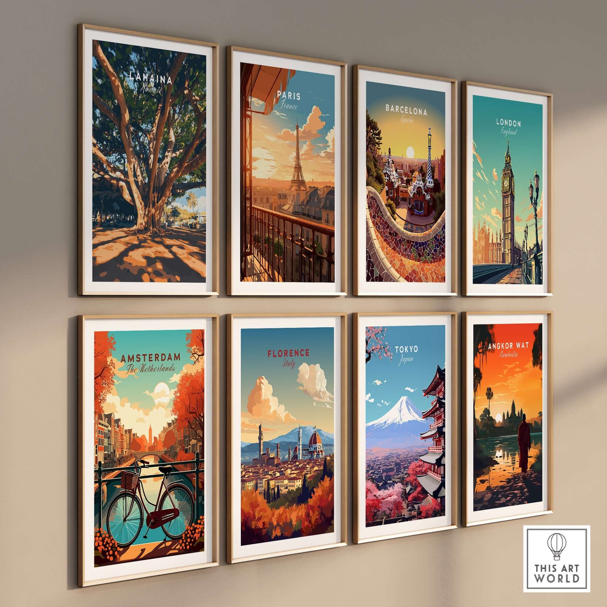 Lahaina Travel Print and other city travel prints displayed in frames on a wall.