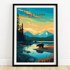 Lake Clark National Park art print with bear, lake, and mountains in black frame on wooden floor