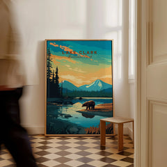 Framed Lake Clark National Park travel poster with bear, mountains, and river on checkered floor.