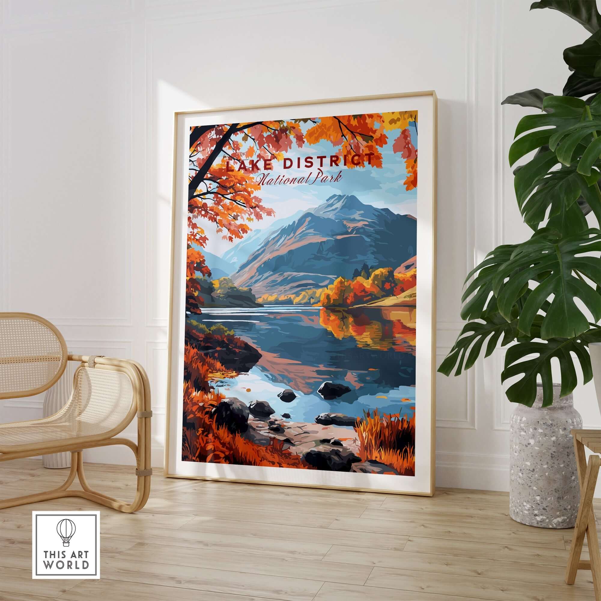 Lake District England Poster displayed in a modern room with autumn scenery and serene lake reflections.