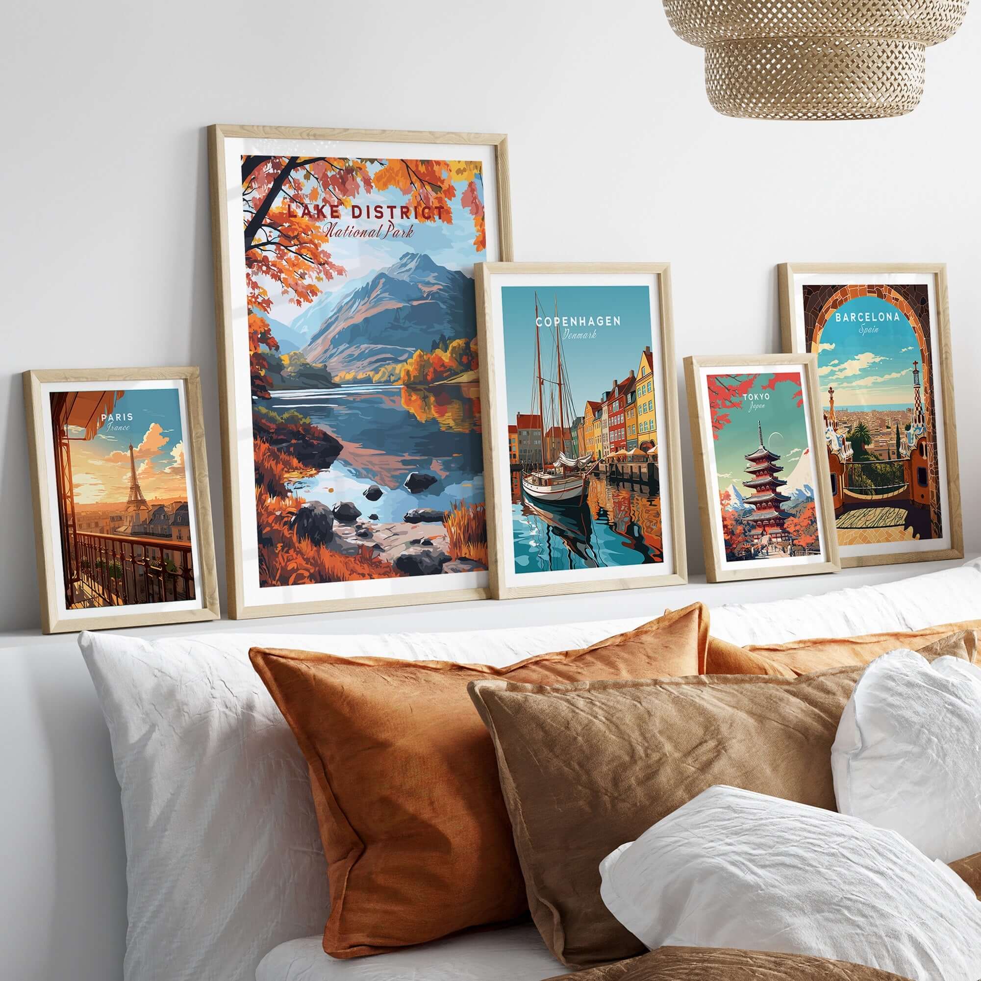 Lake District England Poster displayed among framed travel posters in a cozy home setting.