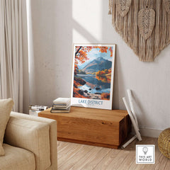Lake District England Print displayed in a cozy living room with scenic autumn landscape.
