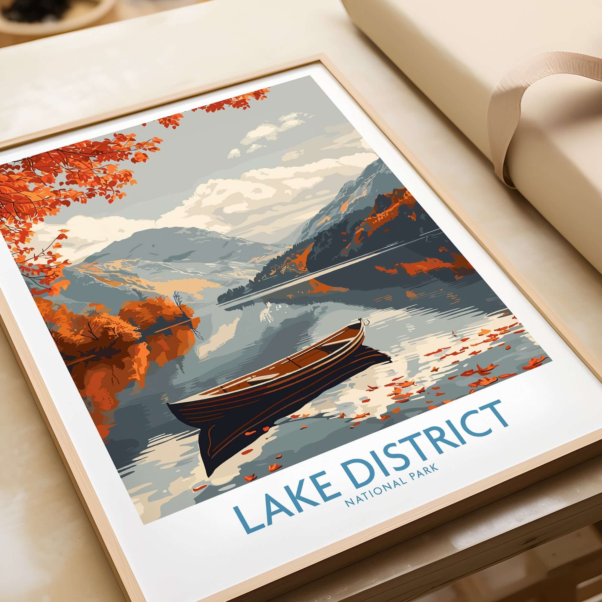Lake District England Wall Art featuring a serene view of a boat and autumn landscape.