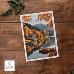 Lake District Poster featuring a tranquil lakeside view with autumn foliage and a charming cottage.