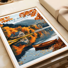 Lake District Poster showcasing a serene autumn landscape with a house and boat reflecting on the water.