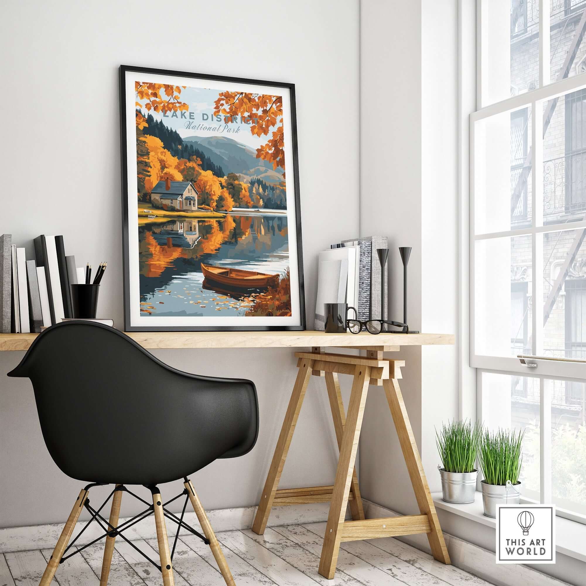 Lake District Poster displayed on a wall in a modern workspace, showcasing scenic autumn landscape.