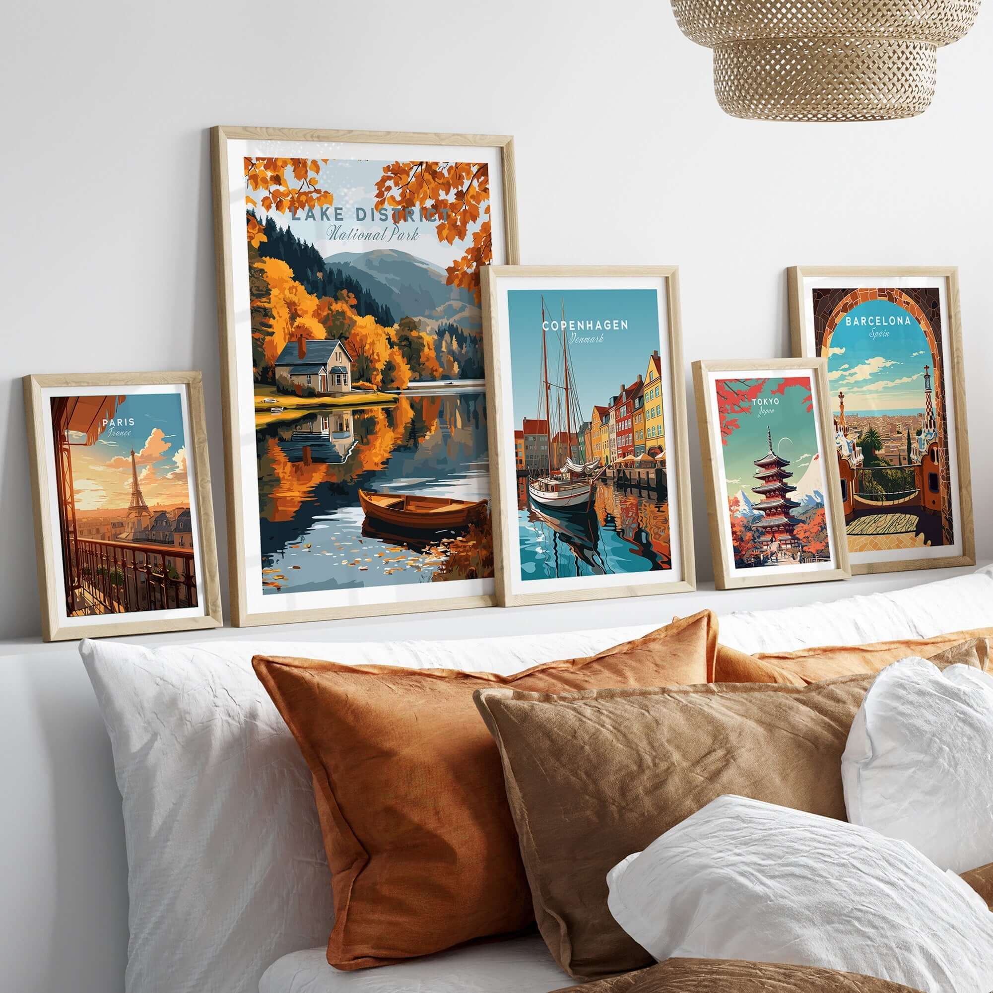 Lake District Poster alongside travel posters in a stylish living room decor setting.