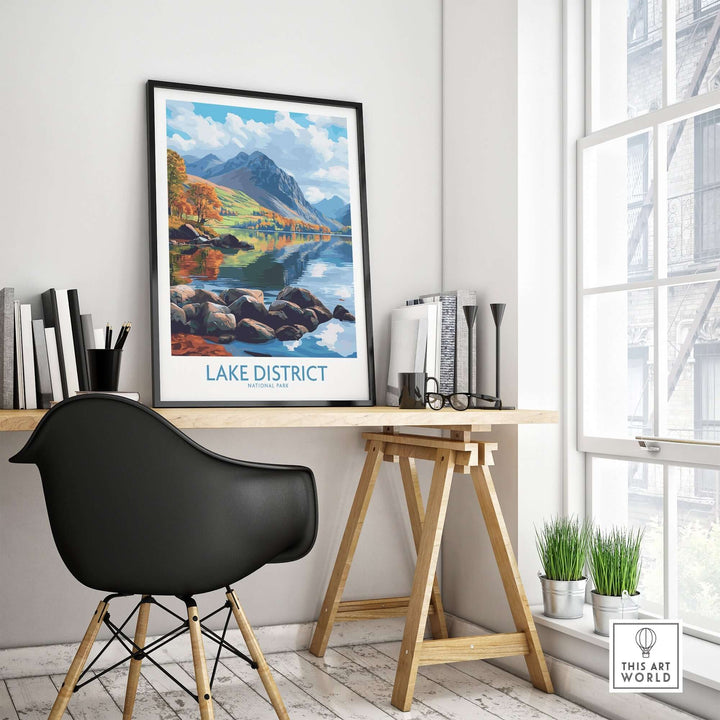 Lake District travel poster displayed in a stylish interior with a desk and chair, showcasing vibrant colors and scenic views.