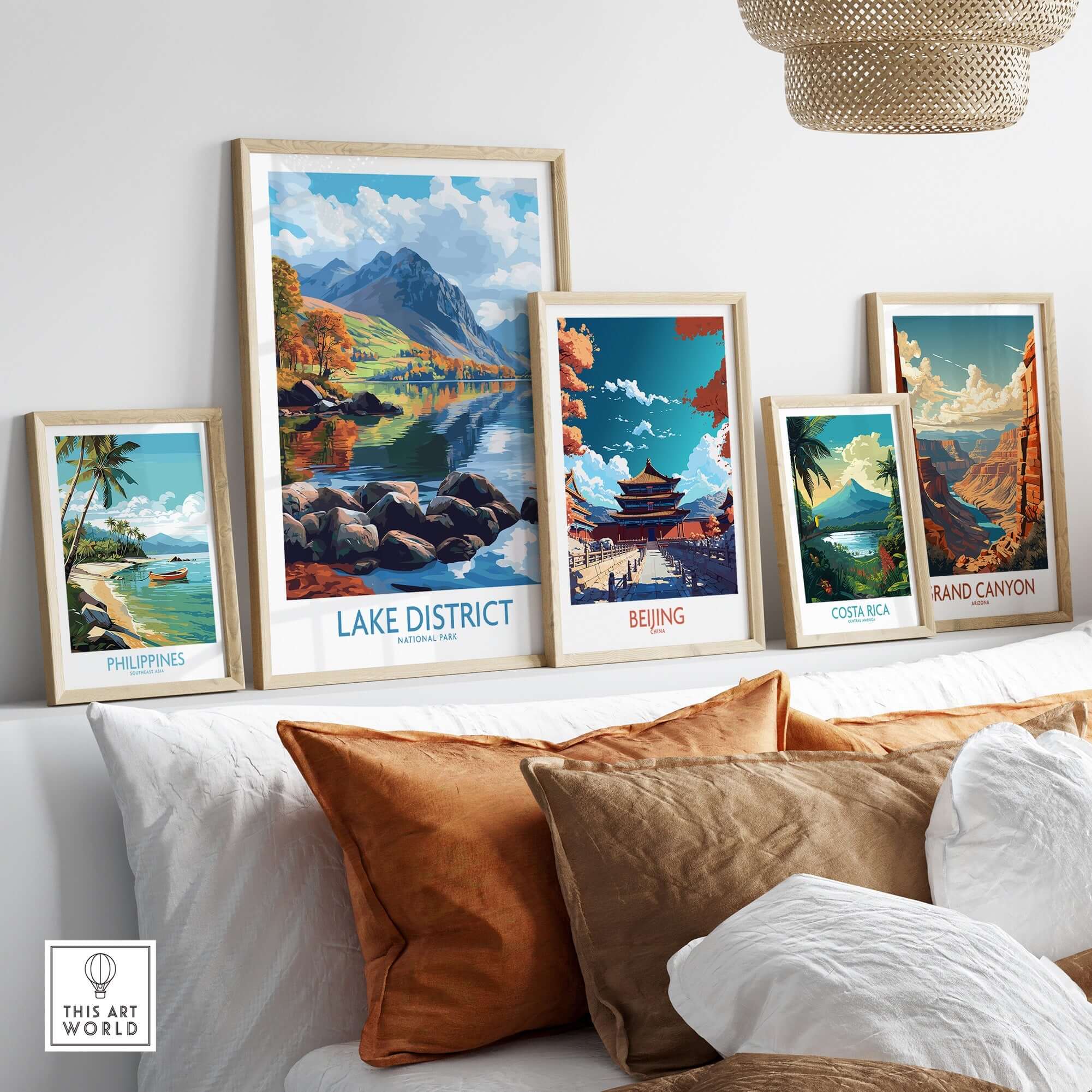 Lake District Travel Poster displayed prominently among other travel posters in a stylish interior setting.