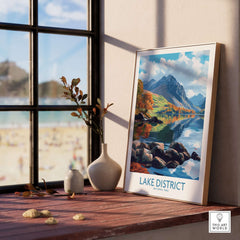Lake District Travel Poster displayed in a sunny room with mountains and vibrant colors reflecting on water.