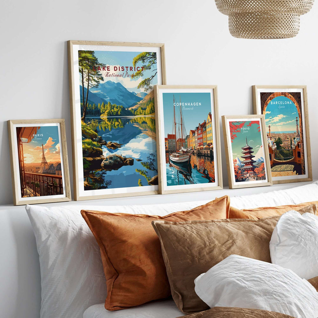 Framed Lake District wall art alongside travel posters, enhancing a cozy living room aesthetic.