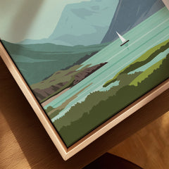 Framed mountain lake art print with sailboat, perfect for home decor and travel-themed wall art.