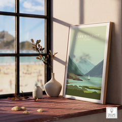 Lake District England travel poster with mountains, lake, and sailboat, framed on windowsill for home decor