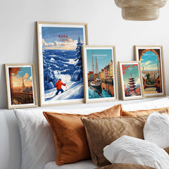 Lapland ski landscape art prints on a wall, featuring Ruka Finland, Copenhagen, and Barcelona scenes.
