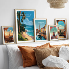 Framed travel posters of Paris, Las Terrenas, Copenhagen, Tokyo, and Barcelona for wall art decor