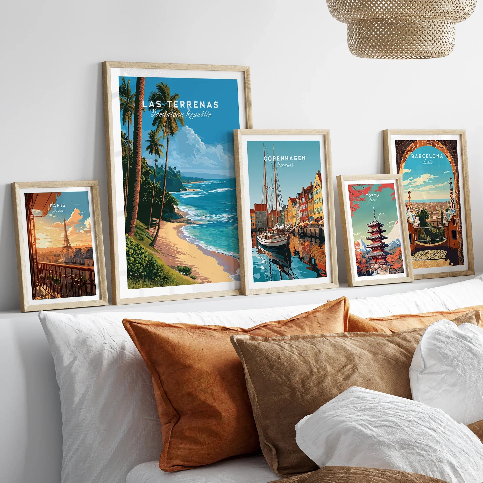 Framed travel posters of Paris, Las Terrenas, Copenhagen, Tokyo, and Barcelona for wall art decor