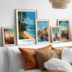 Framed travel posters of Paris, Las Terrenas, Copenhagen, Tokyo, and Barcelona for wall art decor