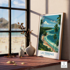 Las Terrenas Dominican Republic travel poster with palm trees, beach, and ocean, framed on windowsill